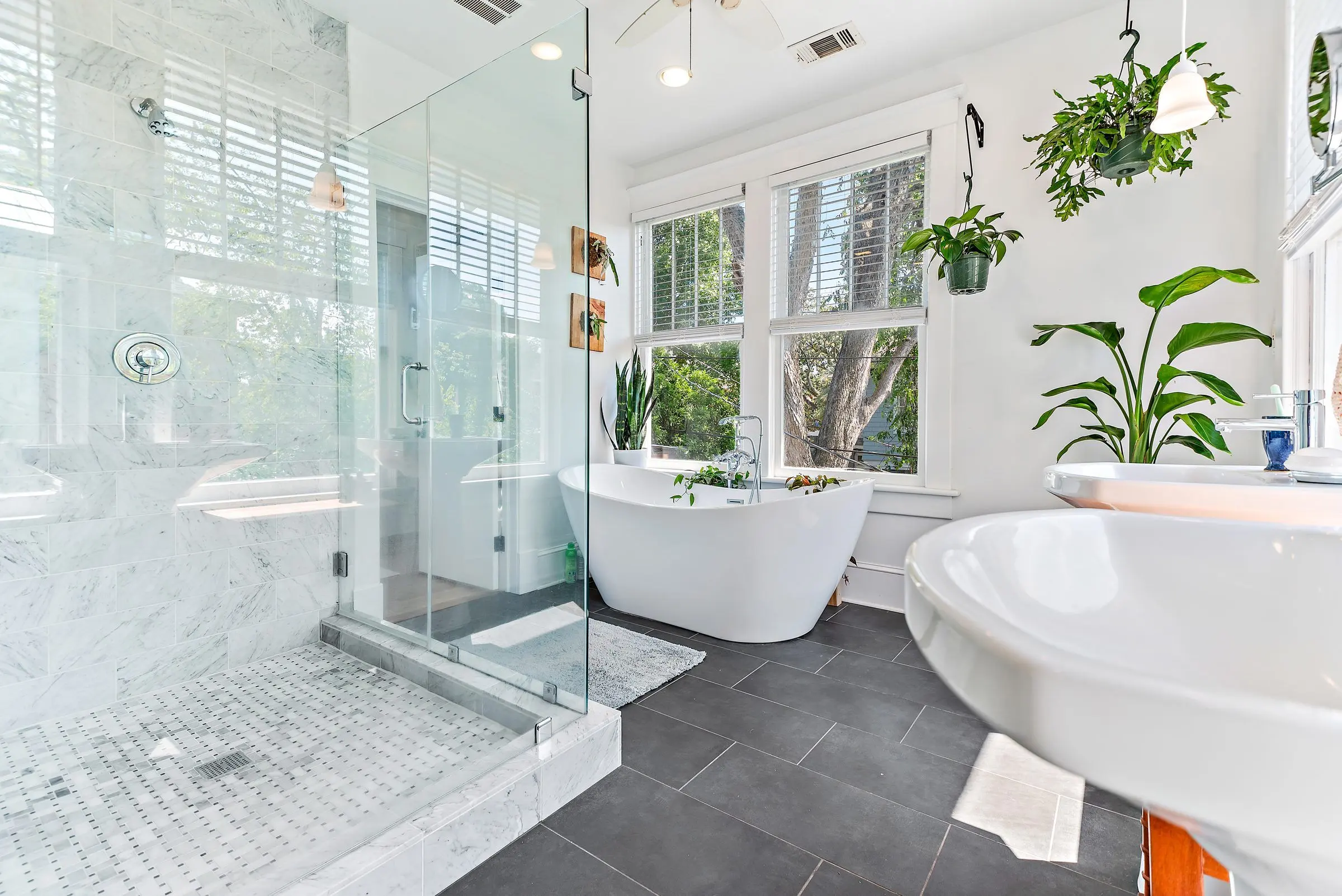 Bathroom with a glass shower and a freestanding tub