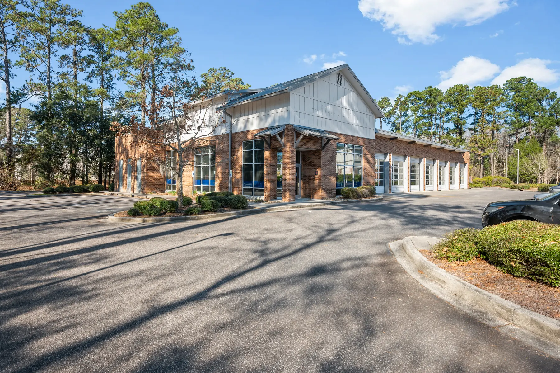 Front exterior of a home with a covered entry and lawn